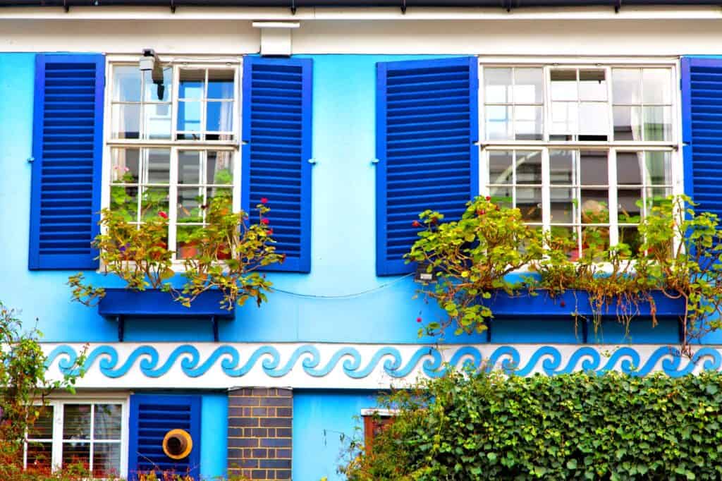 Brightly coloured house in Notting Hill with flowers
