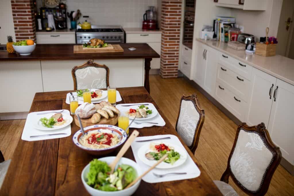 A dining table laid with meal